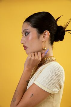 Swing into style with our Chain Orbit Earrings! Featuring dangling chains that orbit around your ears, these earrings add a playful touch to any outfit. They're the perfect accessory for those who like to have fun and not take themselves too seriously. Order now and let the good times orbit! 18k gold-plated or Stainless Steel Lightweight | hypoallergenic | 2" drop Handmade in Los Angeles Follow these tips to keep your jewelry looking its best! Face Jewellery, Nameplate Necklace, Lip Ring, Knuckle Rings, Chrome Colour, Belly Chain, Hand Chain, Bead Charm Bracelet, Dangly Earrings