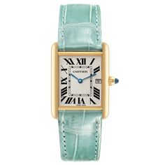 Cartier Tank Louis Yellow Gold Teal Leather Strap Mens Watch W1529756. Quartz movement. 18k yellow gold case 25.0 x 33.0 mm. Circular grained crown set with a blue sapphire cabochon. . Scratch-resistant mineral crystal. Silvered opaline dial with black radial Roman numeral hour markers and inner minute track. Sword shaped blue hands. Date calendar at 3 o'clock aperture. Secret Cartier signature at VII. Teal leather strap with 18K yellow gold tang buckle. Cartier Tank Louis, Sapphire Cabochon, Teal Leather, Amazing Watches, Used Watches, Cartier Tank, Date Calendar, Cartier Watch, Roman Numeral