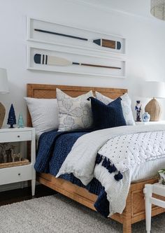 a bedroom with white walls and blue accents