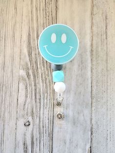 Happy Face Badge Reel |Face Badge Reels | Badge Reel Nurse Cute | Retractable Badge Clip | Badge Reel Medical | Badge Holder The perfect badge reel to brighten your day!  *Little Birdie Blue colored glitter sealed with resin  *2 inches in diameter *Reel Cord Length is approximately 28 inches *Belt clip  *Interchangeable top *Bead color may vary slightly *Listing is for 1 badge reel *Please note the following: - Colors on screen may vary from colors on final products. - Badge reels are made with Medical Badge, Nurse Badge Reel, Belt Clip, Air Bubbles, Badge Holder, Happy Face, Blue Glitter, Badge Holders Lanyard, Badge Holders