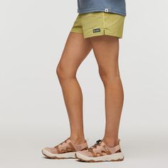 For those active days hiking, bouldering, swimming, and hanging out around the campfire, you only need one short: the unmistakably retro Brinco. | Cotopaxi Women's Brinco Shorts - Solid in Lemongrass | Size Small Around The Campfire, West Java, Semi Annual Sale, Snap Back, Snap Backs, Lemon Grass, Campfire, Bouldering, Drain