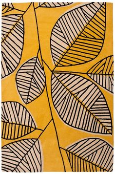 a yellow rug with black and white leaves on the front, in an abstract pattern