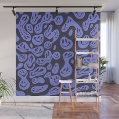 a purple and black wall mural in an empty room