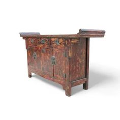 The restoration to this countryside altar table was kept to minimum. With its original paint and hardware, this antique Chinese countryside sideboard buffet table shows rich patina, nicely aged warm texture, and lines developed over time. Handsome brass ware, It has 2 compartments, 2 shelves in each with a removable shelf.    Item No.:                        SB249 Overall Dimension:        63.8"W, 16.1"D, 37.0"H Circa:                              Vintage Material:                         Elm Origin:                            Shanxi, China Condition: Solid construction, Age proper lines, dots, patina, faded painting, & imperfection. Wear & tear consistent with age and use. Faded Painting, Chinese Countryside, Shanxi China, Altar Table, Tv Sideboard, Two Shelves, 2 Shelves, Cabinet Shelving, Vintage Material