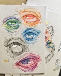 several drawings of different colored eyes on top of each other