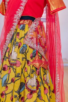 Look no further for a perfect festive outfit than this ravishing Yellow and Crimson Red Kanchi Pen Kalamkari Lehenga. This distinctive combination of enchanting colors will surely make you the center of attention. Perfect for special occasions, its luxurious fabric and intricate details will captivate every onlooker. Make a bold statement with this one-of-a-kind ensemble. Kalamkari Lehenga, Kids Wear Boys, Kids Wear Girls, Block Print Saree, Fancy Gowns, Silk Thread Bangles, Silk Saree Banarasi, Bridal Silk Saree, Embroidered Dupatta