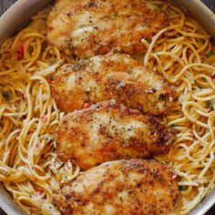 some chicken and noodles in a pan on a table