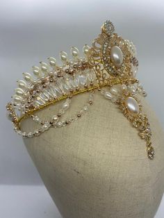 Professional ballet headpiece for the role of Gamzatti, in the ballet "La Bayadere", This impressive, hand made tiara features a golden frame, pearls in different shapes and sizes, as well as a dramatic big pearl drop. Absolutely stunning! Delivery time: 10 to 15 days $ 320 Ballet Necklace, Ballet Headpieces, Professional Ballet, Golden Frame, Big Pearl, The Ballet, Hand Ring, Pearl Drop, Royal Family