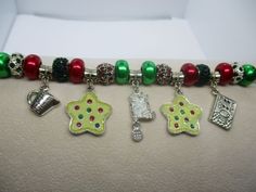 #3164 Handmade, Large Bead Silver Plated "Baking Cookies" Christmas Bracelet... 7 3/4-8".. $30..This item and items for the entire family can be found at my website www.charmedbycharmsbycindy.com Stop over and visit and see all my amazing items that I have for sale.. Thanks !!! Cookies Christmas, Baking Cookies, Christmas Cookies, Silver Plated, Charm Bracelet