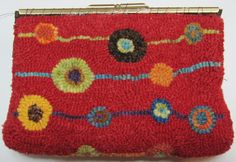 a red purse with colorful flowers on it