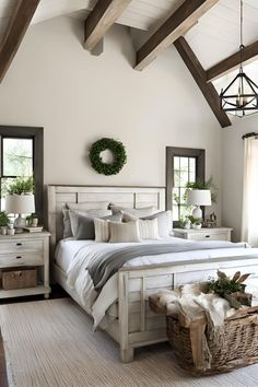 a bedroom with white walls and wooden beams on the ceiling is decorated in neutral colors