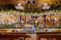 an elaborately decorated room with chandeliers and flowers