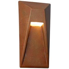 a light that is on the side of a brown wall lamp with a white light at the end