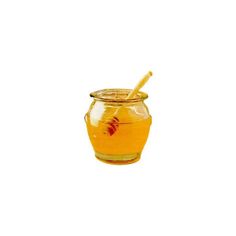 a glass jar filled with honey and a wooden spoon sitting on top of it's side