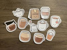 coffee stickers on a wooden table with cups and mugs in the middle,