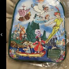 Brand New Loungefly Disney Peter Pan Cast Painting Backpack Featuring A Front Painting Like Graphic Of Peter, Wendy, Captain Hook, The Lost Boys, And The Rest Of The Cast From The Animated Disney Classic Also Features And Enamel Brand Badge , Goldtone Hardware And Interior Lining Pattern Of Peter And The Darling Siblings Soaring Away Green Disney Backpack For Travel, Green Backpack For Disney Trips, Themed Travel Backpack, Green Disney Travel Backpack, Disney Themed Standard Backpack For Theme Park, Disney Green Travel Backpack, Themed Backpack For Theme Park, Peter Pan Cast, Themed Standard Backpack For Theme Park