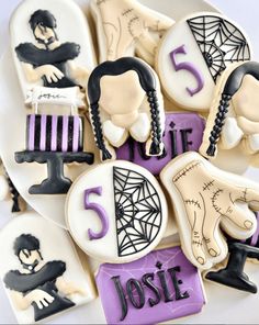 decorated cookies are arranged in the shape of hair stylists