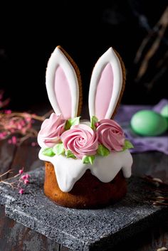 a bundt cake decorated with flowers and bunny ears