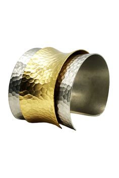 A imitation rhodium-plated hammered brass cuff is wrapped with 14K gold-plated brass that is perfectly downtown chic. The textured hammered brass provides the light weight and rich tones for a contemporary look. Made in the Garment District of New York City where a team of artisans handcraft every piece of jewelry in their collection. 14K Gold, Brass, Imitation Rhodium 2" Width, 7 1/2 Circumference Fits up to a size 7 1/2 Made in the USA Ships from the USA Why do we love this cuff? Once we saw t Sterling Silver And Gold Hammered Cuff, Brass Cuff, Hammered Brass, Gold Brass, Rhodium Plated, A Team, York City, New York City, Size 7