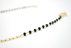 If you're looking for a subtle and classy piece, this chain is the one for you. The elegant gold loops and black spinal stone make for a delicate yet versatile combination. Whether you're going for a casual vibe or a fancy night out, this chain can be styled for any occasion. Gold Glasses, Black Gems, Glasses Chain, Black Spinel, Classic Gold, Gold Chain, Gold Chains, Vintage Inspired, Night Out