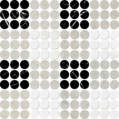 black and white circles are arranged in the shape of an abstract pattern on a white background