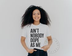 Show off your confidence with our unisex jersey t-shirt, featuring the iconic rap lyrics, "Ain't Nobody Dope As Me" in a bold font. Perfect for hip hop and rap enthusiasts, this tee captures the essence of swagger and self-assurance that defines the genre. 🎤✨ Made from high-quality, soft fabric, this t-shirt ensures both comfort and style, making it an ideal choice for any casual outing or event. Whether you're heading to a concert, chilling with friends, or just expressing your love for rap music, this shirt is a standout piece in any wardrobe. 🌟👕 The striking design and powerful message of this t-shirt make it a must-have for anyone who appreciates the artistry and impact of hip hop. Celebrate your unique style and attitude with this bold statement piece. 🖤🎶 * * * * * * * * * * * * Lyric Shirts, Hip Hop Shirts, Rap Songs, Rap Lyrics, Rap Music, Soft Fabrics, Unique Style, Rap, Hip Hop