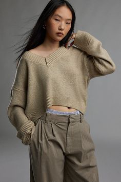 Forever staple BDG sweater in an effortless pull-over style. Designed in a boxy & cropped fit featuring a wide v-neckline and drop shoulders for a slouchy look. Finished with ribbed knit trim. Find it only at Urban Outfitters. Features BDG Jenna v neck sweater Slouchy sweater Soft and stretchy knit Wide v-neckline and long sleeves with ribbed knit trim Ribbed knit hem Boxy, relaxed fit Cropped length Easy pull-over style UO exclusive Contents + Care 53% Recycled polyester, 47% polyester Machine Bdg Sweater, Live Set, Slouchy Sweater, Women Men Shoes, Small Chest, V Neck Sweater, Vneck Sweater, Neck Sweater, Ribbed Knit