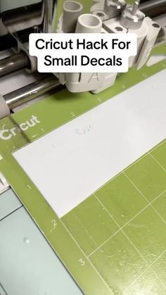 a close up of a machine cutting paper with the words cricut hack for small decals