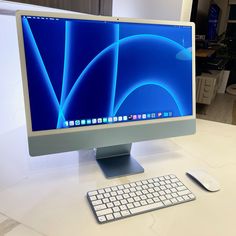 a desktop computer sitting on top of a white desk