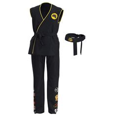 a woman's black karate outfit with yellow accents