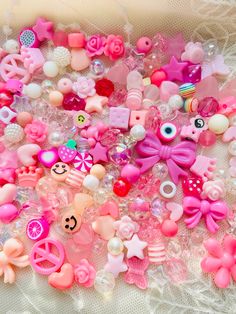 there are many different types of buttons on the lace table cloth, and one is pink