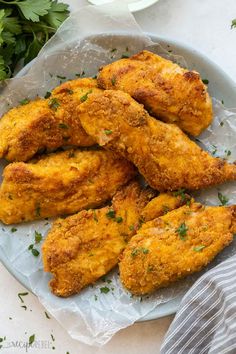 fried chicken on a plate with parsley