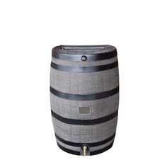 a large wooden barrel sitting on top of a white floor