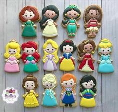 there are many princess cookies on the table