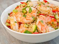 a white bowl filled with rice and shrimp