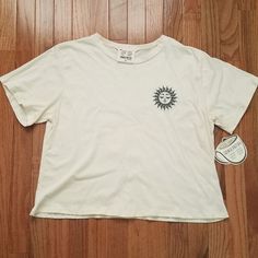 This French Pastry Women's Cropped T-Shirt Is Beautiful Cream Color And Is Made Of 100% Cotton. Very Comfortable, Features A Crew Neck And Short Sleeves, Making It Perfect For Any Season, Whether It's Winter, Summer, Fall, Or Spring. Made In Mexico And Is Of High Quality. Will Add Style And Trendy T-Shirt To Your Wardrobe. Includes A Delicious Recipe Questions? Leave A Comment Below! Casual Cream Everyday Top, Casual Cream Tops For Everyday, Casual Everyday Cream Top, Cream Tops With Graphic Print And Relaxed Fit, Cream Relaxed Fit Top With Graphic Print, Relaxed Fit Cream Top With Graphic Print, Cream Graphic Tee With Crew Neck, Cream Graphic Print Tops For Everyday, Cream Tops With Graphic Print For Everyday