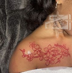 a woman with a tattoo on her shoulder