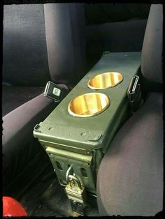 two metal bowls sitting in the back seat of a car