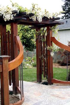 two wooden structures with flowers growing on them