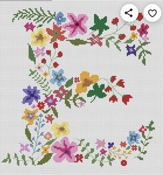 a cross stitch pattern with the letter e in it's center and flowers on each side