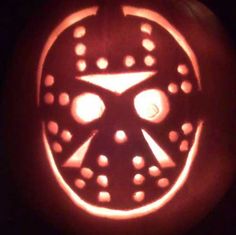 a carved pumpkin with holes in the center