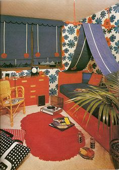 a living room filled with lots of furniture and decor on top of a red rug