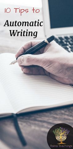 a person's hand holding a pen and writing on top of an open notebook