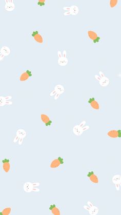 an image of rabbits and carrots on a blue background for wallpaper or fabric