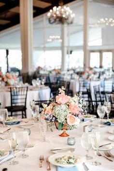 Image of the wedding reception space at the Cape Club of Sharon, a wedding venue in Massachusetts. The photo features the tables in the reception space with pastel Wedding Flower Centerpieces at the Cape Club of Sharon Wedding Flower Centerpieces, Flowers Photo