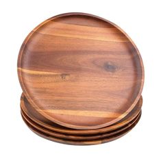 four wooden plates stacked on top of each other