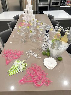 the table is covered with wine glasses and condiments for an elegant dinner party