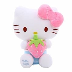 a hello kitty stuffed animal holding a strawberry