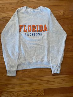 8 oz 50/50 cotton/poly cozy and comfortable light grey crew sweatshirt Comfy Casual Summer Outfits, Lacrosse Sweatshirt, Lacrosse Hoodie, College Crewneck Sweatshirts, Trendy Sweatshirts, What Should I Wear, College Sweatshirt, Birthday List, Baltimore Md