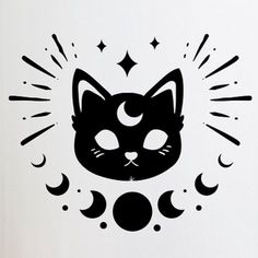 a black cat with stars and crescents on it's face is sitting in front of a white wall